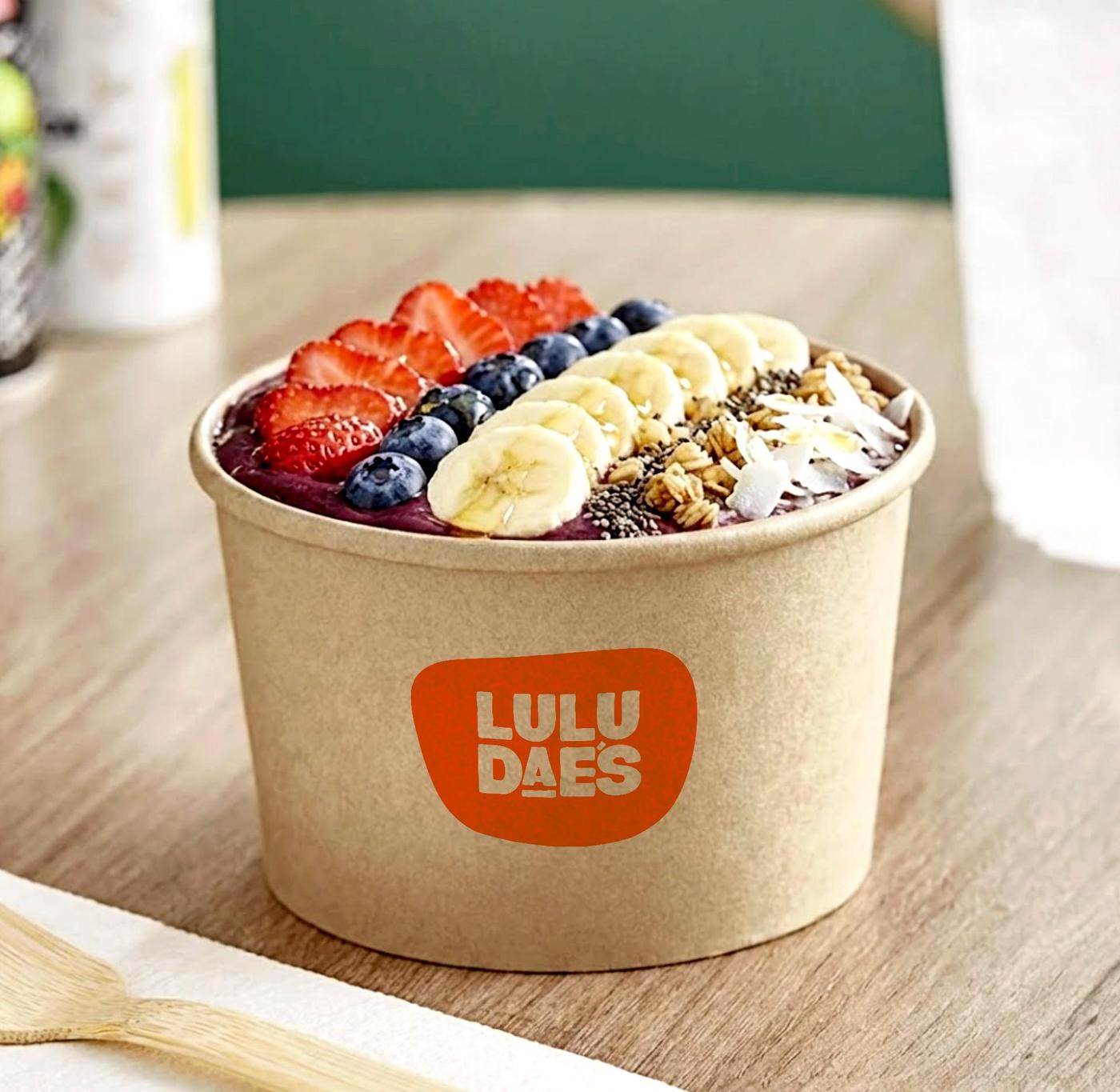 Açaí bowl with strawberry, blueberry, banana and granola in a Lulu Dae's compostable bowl