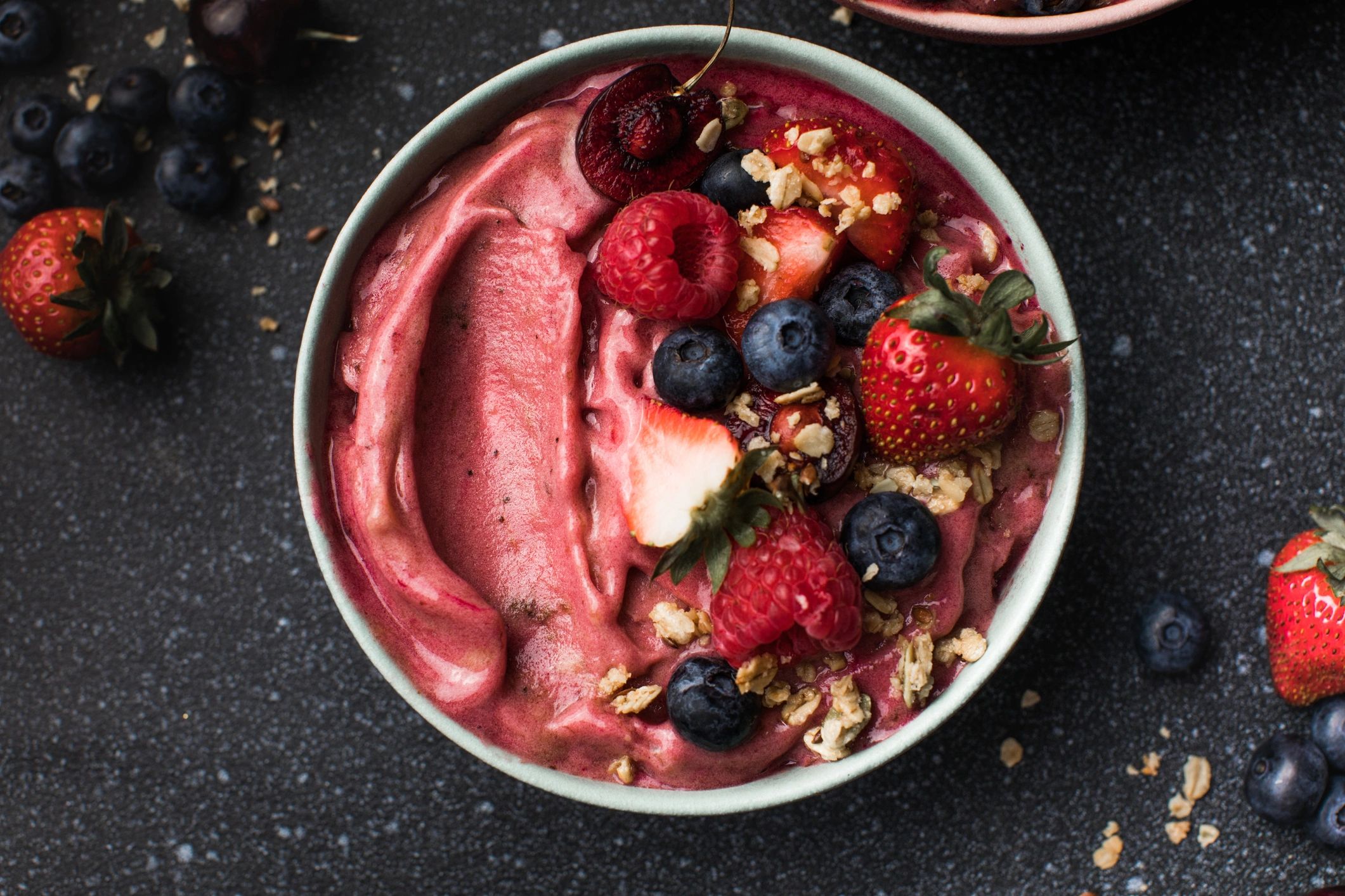 Açaí bowl with granola, banana and strawberries